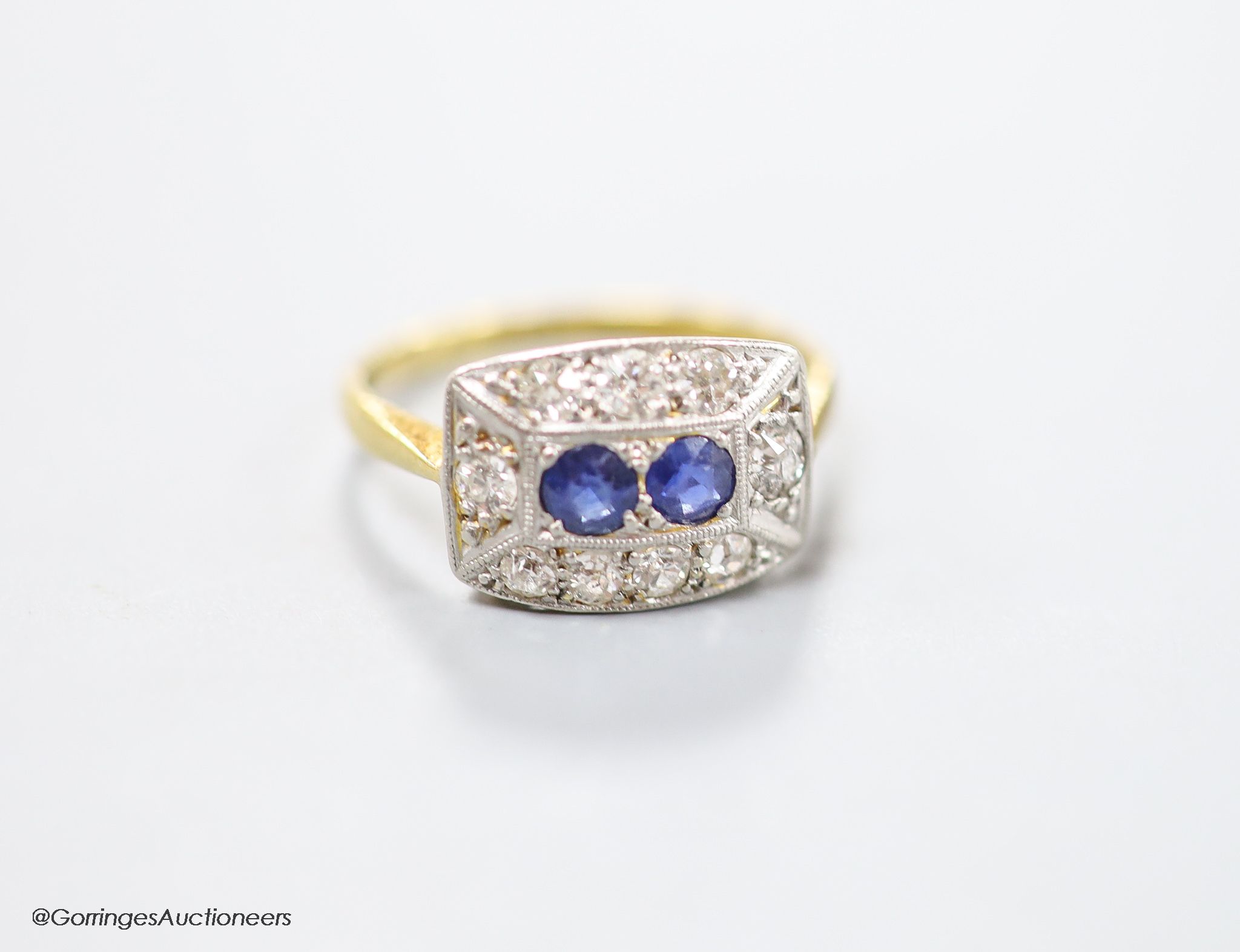 A 1930's/1940's 18ct & Pt, sapphire and diamond set shaped rectangular cluster ring, size M, gross weight 3 grams.